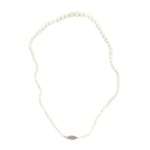 This is a stunning example of a classic Japanese akoya saltwater cultured pearl necklace.  The pearls are graduated and range from 3.00-7.00mm. They are round with excellent luster and sharp rosy overtones. The have almost no blemishes.  Clasp is in solid yellow gold and is a filigree design. It is stamped "14K".  Total length is 17.50 inches.  All pearls are truly vintage and have only been lightly cleaned and restrung.