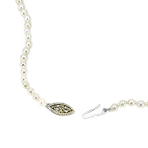 This is a stunning example of a classic Japanese akoya saltwater cultured pearl necklace.  The pearls are graduated and range from 3.00-7.00mm. They are round with excellent luster and sharp rosy overtones. The have almost no blemishes.  Clasp is in solid yellow gold and is a filigree design. It is stamped "14K".  Total length is 17.50 inches.  All pearls are truly vintage and have only been lightly cleaned and restrung.